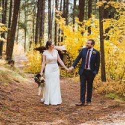 Couple walking from yurt to lodge in fall