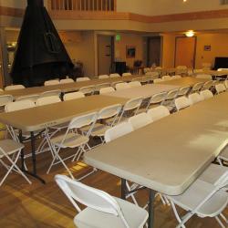 main room of lodge with tables and chairs