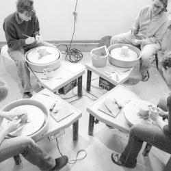 Mijanou pottery with people making pots